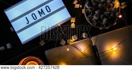 Lightbox With Text Jomo Joy Of Missing Out. The Concept Of Relaxation From Information And Gadgets. 