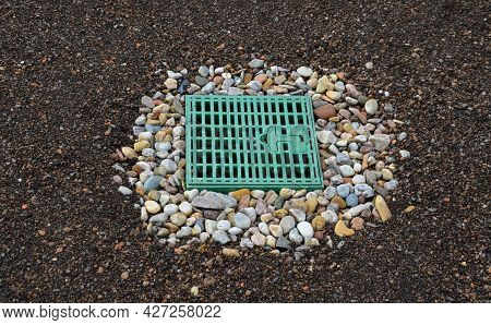 Roof Gutter Covered With A Square Plastic Green Grid. Green Roofs Covered With Substrate. The Area A