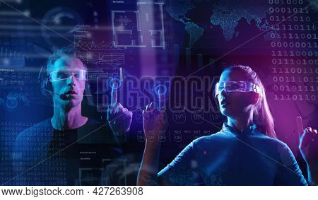 Young woman and man controlling digital environment. Future, mind controlling, digital interface concept.