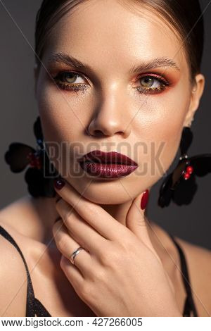 Adalt Model With Professional Make Up And Trendy Hairstyle