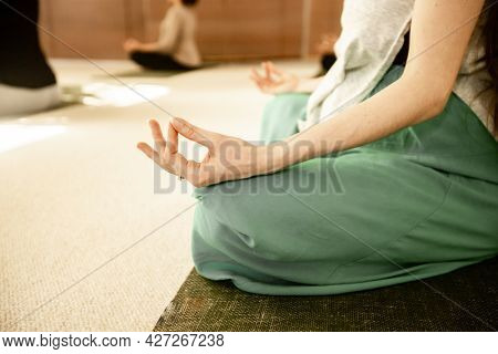 young pregnant woman practicing maternity yoga
