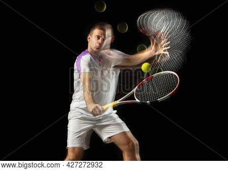 Portrait Of Young Man, Male Tennis Player In Motion And Action Isolated On Dark Background. Strobosc