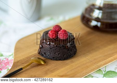 Healthy Chocolate Fondant.chocolate Fondant Decorated With Berries.chocolate Dessert With Glaze With