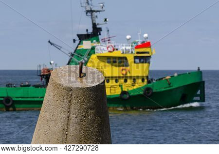 Dolos And Tugboat - Coastal Fortifications Against The Background Of The Auxiliary Ship