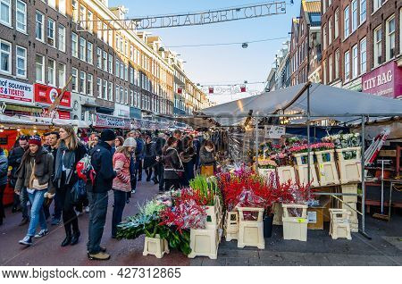 Amsterdam, The Netherlands - November 17, 2018: People Visiting The Albert Cuyp Market, A Street Mar