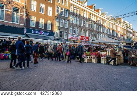 Amsterdam, The Netherlands - November 17, 2018: People Visiting The Albert Cuyp Market, A Street Mar