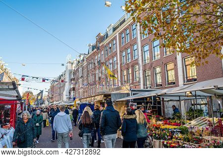 Amsterdam, The Netherlands - November 17, 2018: People Visiting The Albert Cuyp Market, A Street Mar