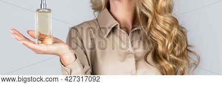 Beautiful Girl Using Perfume. Woman With Bottle Of Perfume. Woman Presents Perfumes Fragrance. Perfu