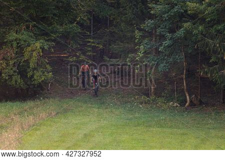 Two Girls On Mtb Bikes. Mother And Daughter Riding On A Trail.