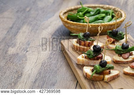 padron pepper, chorizo, and bacon pintxos.  spanish appetizer