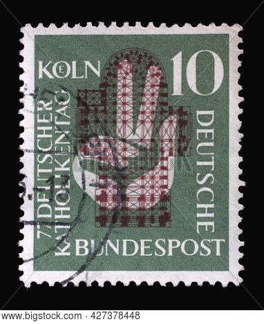 ZAGREB, CROATIA - AUGUST 29, 2014: Stamp printed in Germany, shows a hand raised to the oath in front of the floor plan of the Cologne Cathedral, 77th German Catholic Day in Cologne, circa 1956