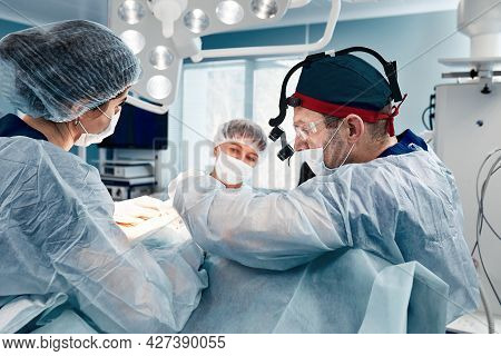 A Team Of Women And Men Surgeons Doing Complex Heart Surgery, Cardiovascular Surgery, Modern Medicin