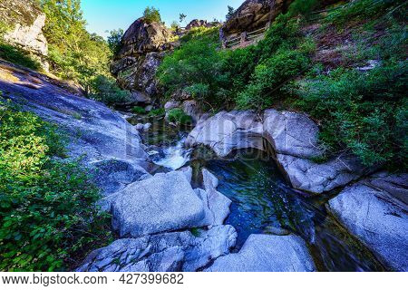 Small Stream Between Rocks At Dawn On A Summer Day. Navacerrada.