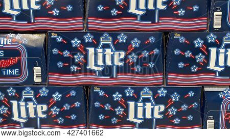 Cases Of Cans Of Miller Lite Beer At A Grocery Store Waiting For Customers To Purchase.