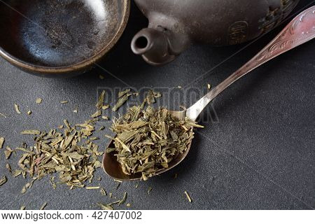 Dry Bancha Green Tea In A Spoon. Japanese Tea