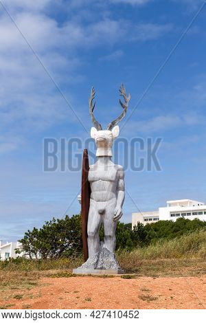 Nazare, Portugal - June 27, 2021: The Famous Statue Of The Deer Surfer The Surfista Da Nazare.