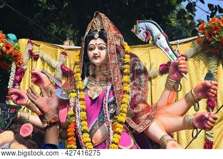 Background Durga Puja Festival And Tableau. Sculpture Of Hindu Goddess Durga
