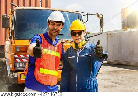 The Caucasian Engineers And Asian Workers Driving The Cargo Truck Partners Work Together In Great Fr