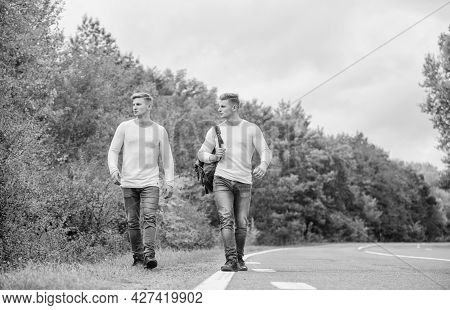 Transporting Issues. Men Backpack Walking Road. Twins Walk Along Road. Brothers Friends Nature Backg