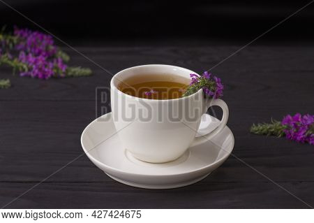 Cup Of Tea With Willow-herb On Wooden Background.herbal Tea From Fermented Kipreya Leaves. Tradition