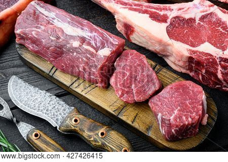 Tenderloin Steak. Raw Beef Steak Cut Set, On Black Wooden Table Background