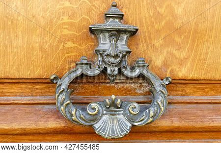 European Vintage Old Metal Wrought Iron Door Knocker. Design Detail. Paris.