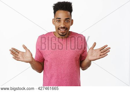 Nothing Say, Empty Hands. Smiling African American Man Spread Hands Sideways, Shrugging Shoulders Cl