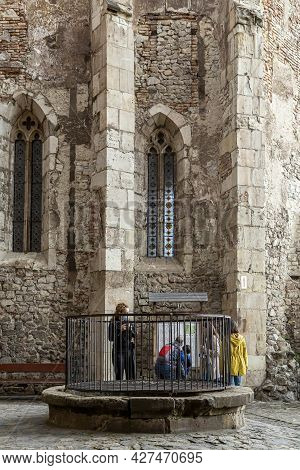 ​ Hunedoara, Transylvania, Romania -  May 31, 2021:  The Fountain Of The  Hunedoara Castle, Also Kno