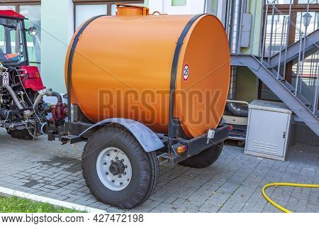 Orange Water Tank For Watering City Streets