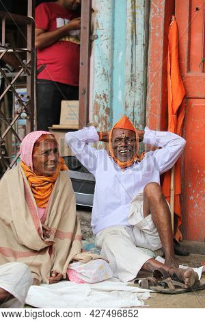 Pune, India - July 11, 2015: A Elderly Indian Pilgrim Couple Resting On Their Way To Pilgrimmage.