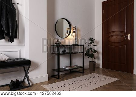 Console Table With Decor And Mirror On White Wall In Hallway. Interior Design