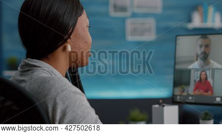 Black Student Discussing Communication Ideas With College Team Having Online Teleconference Meeting 