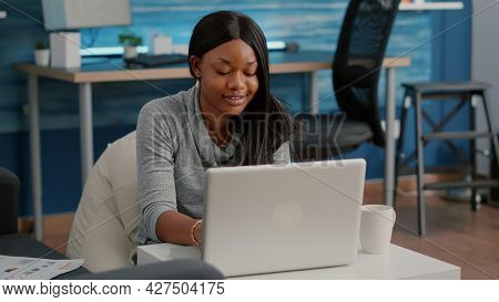 African Student Woman Remote Working From Home While Drinking Coffee Browsing Webinar Education Comp