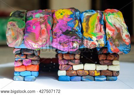 Multi-colored Voluminous Plasticine House From Small Piece Block Elements. Kid Toy. Side View.