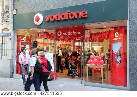 Hamburg, Germany - August 28, 2014: People Visit Vodafone Mobile Phone Store In Hamburg. Vodafone Is