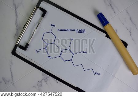 Cannabidiolic Acid Molecule Write On The Paperwork. Structural Chemical Formula. Education Concept