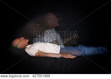 A Unique Multi Flash Image Of Man Lying Down And Rising Representing The Soul Leaving The Body Or As