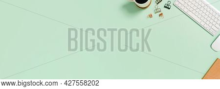 Creative Flat Lay Photo Of Workspace Desk. Top View Office Desk With Keyboard And Mouse On Pastel Gr