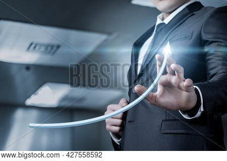 Successful Business Development And Financial Growth Concept. Businessman Clicks The Growth Arrow.