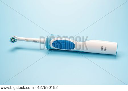 Russia, Moscow, July 22, 2021: Braun Oral-b Toothbrush Head Cross Action Lies On Blue Background. Mo