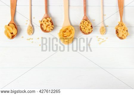Different Types Of Pasta Close-up On A Colored Background