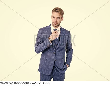 Simply Dapper. Handsome Man Fix Tie Wearing Navy Suit. Dapper Clothing. Formal Wear. Trendy Menswear