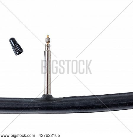 Bicycle Inner  Tube Nipple And Cap On White Background With Space For Text On The Right Side. Presta