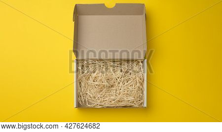 Rectangular Open Corrugated Paper Box With Sawdust Inside. Packaging, Containers For Transportation 