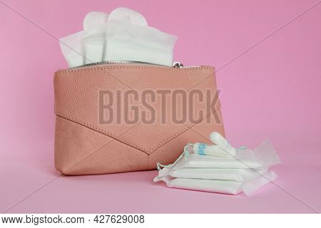 Bag With Menstrual Pads, Pantyliners And Tampons On Pink Background