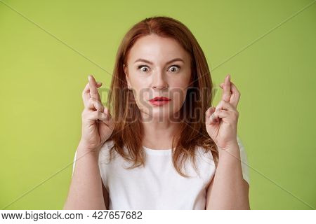 Stunned Intense Worried Middle-aged Redhead Woman Stare Nervously Awaiting Important Result Implore 
