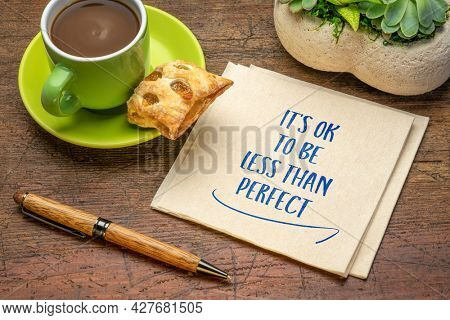 it is OK not to be less than perfect - inspirational handwriting on a napkin with a cup of coffee, acceptance, positive mindset, success and personal development concept