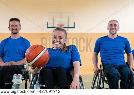 photo of the basketball team of war invalids with professional sports equipment for people with disabilities on the basketball court