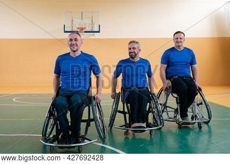 photo of the basketball team of war invalids with professional sports equipment for people with disabilities on the basketball court