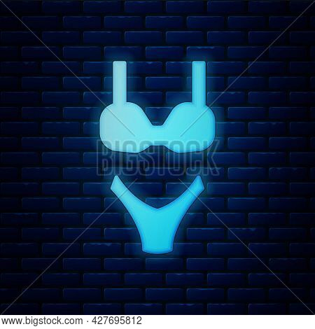 Glowing Neon Summer Beach Swimsuit Icon Isolated On Brick Wall Background. Beach Women Fashion. Vect